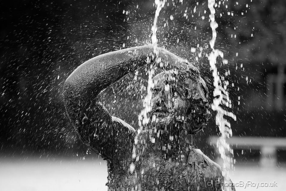 Water Splashing Over A Statue