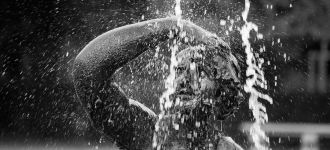 Water Splashing Over A Statue